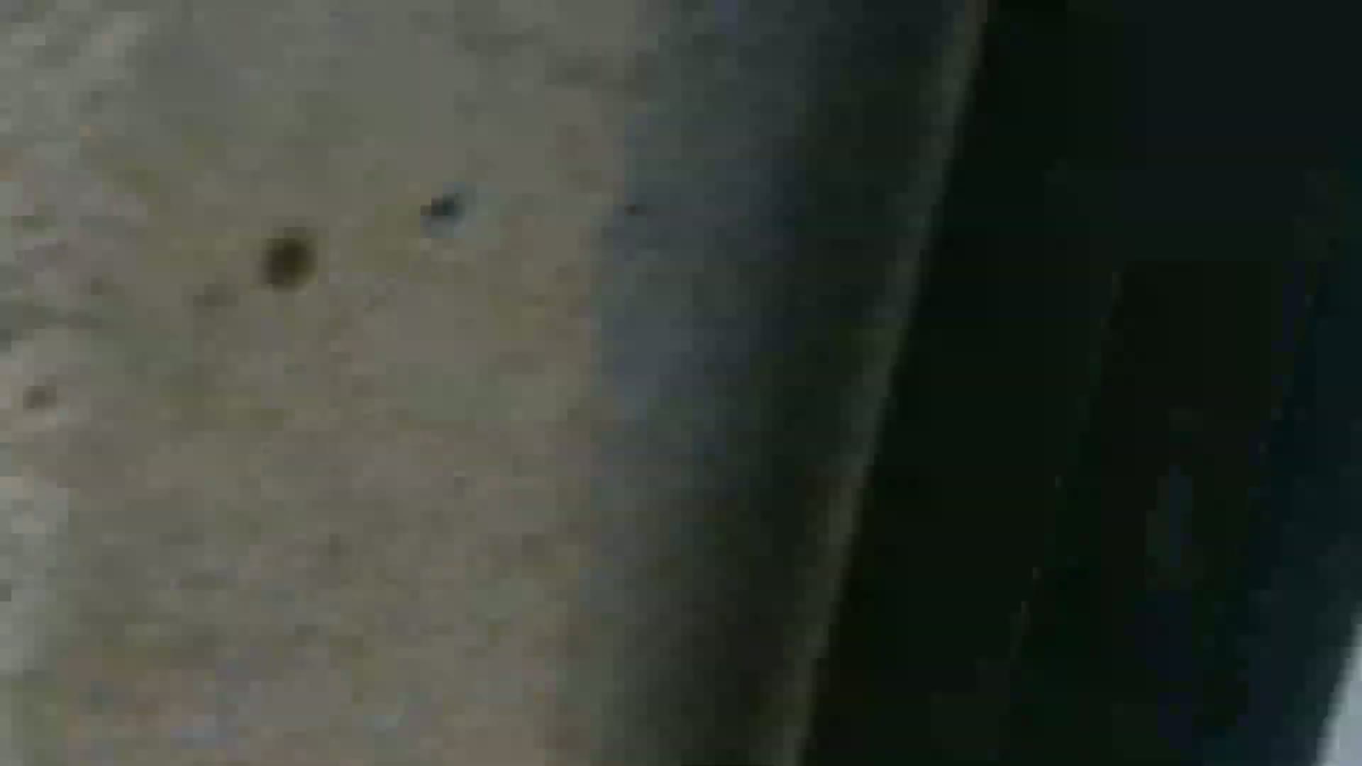 A close-up shows a textured, gray surface with some dark spots, next to a dark, shadowed area.