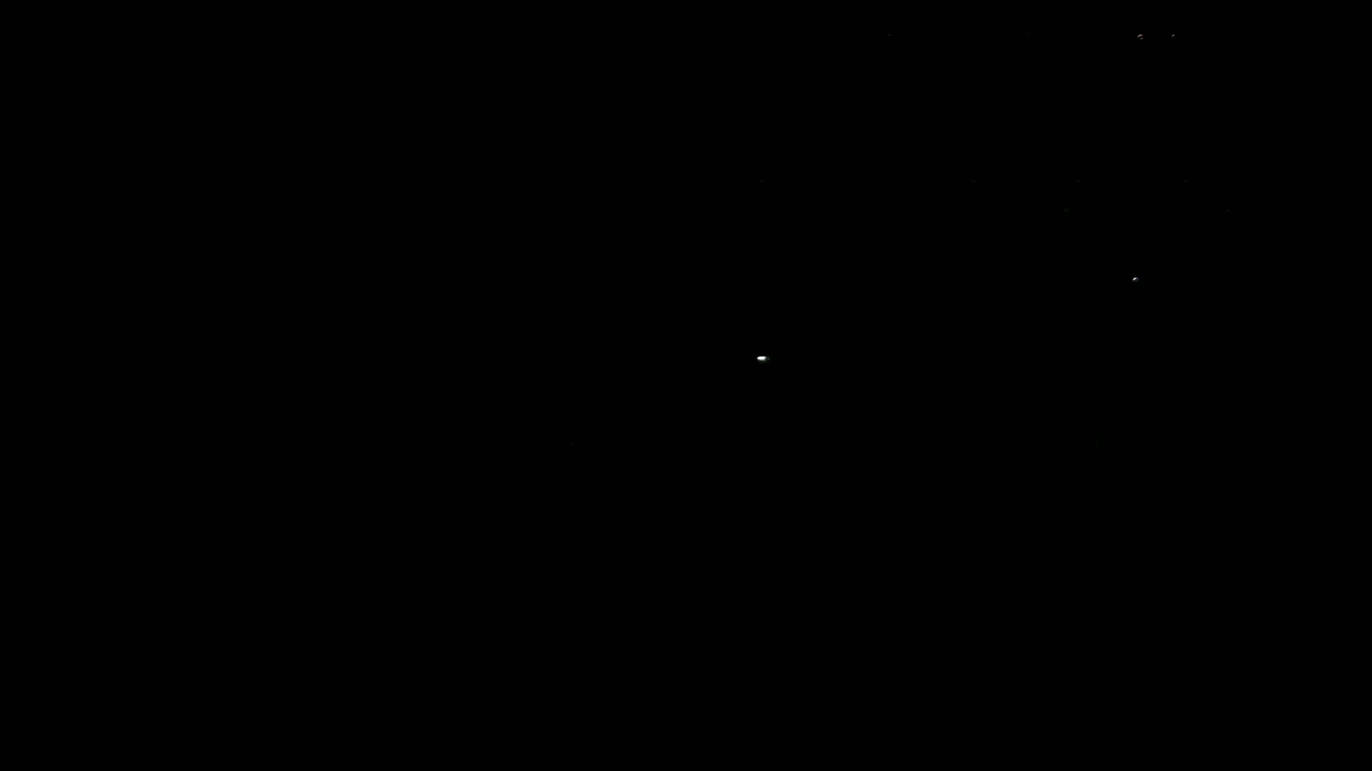 A dark night sky shows a few faint stars.