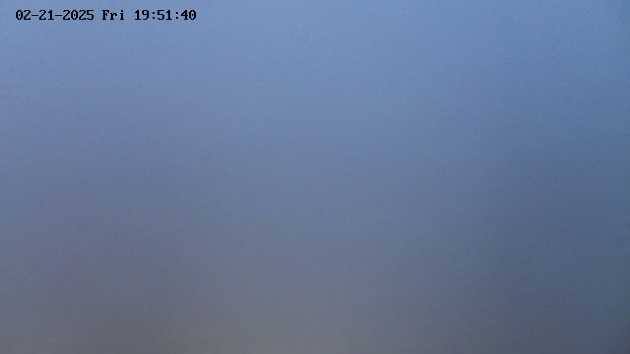 A hazy, light-blue sky is visible.