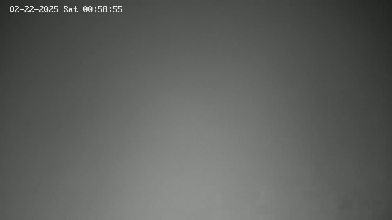 A uniformly dark gray image shows a solid, featureless background.