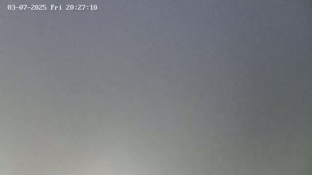 A mostly overcast sky is visible.