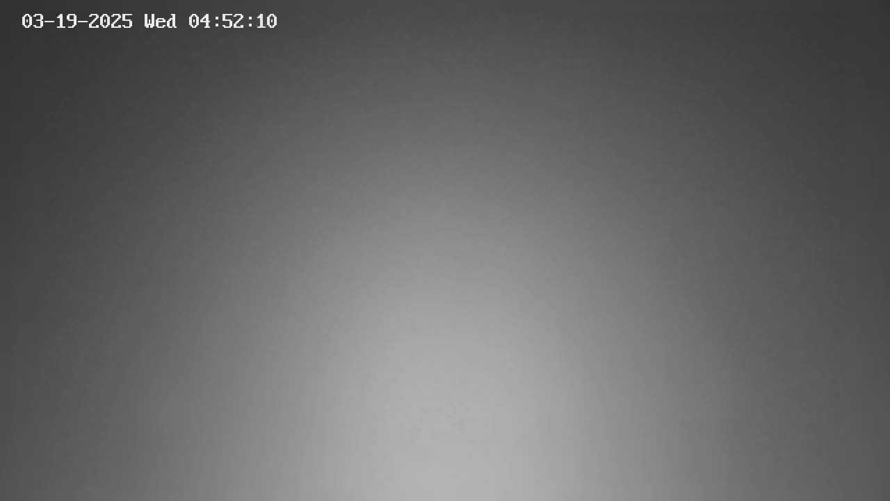 The image shows a uniformly gray, dimly lit scene.