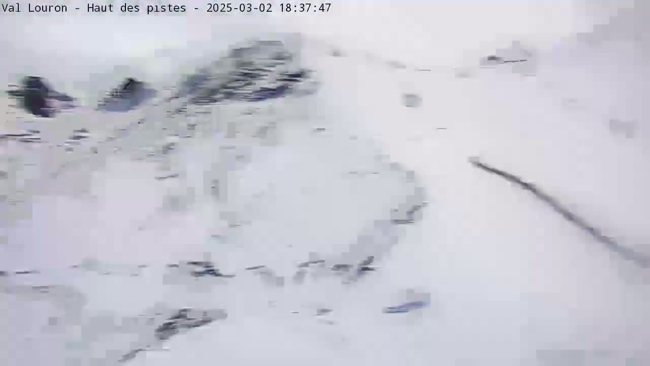 A snow-covered landscape is visible, with dark shapes suggesting rocks or trees partially buried in the snow.