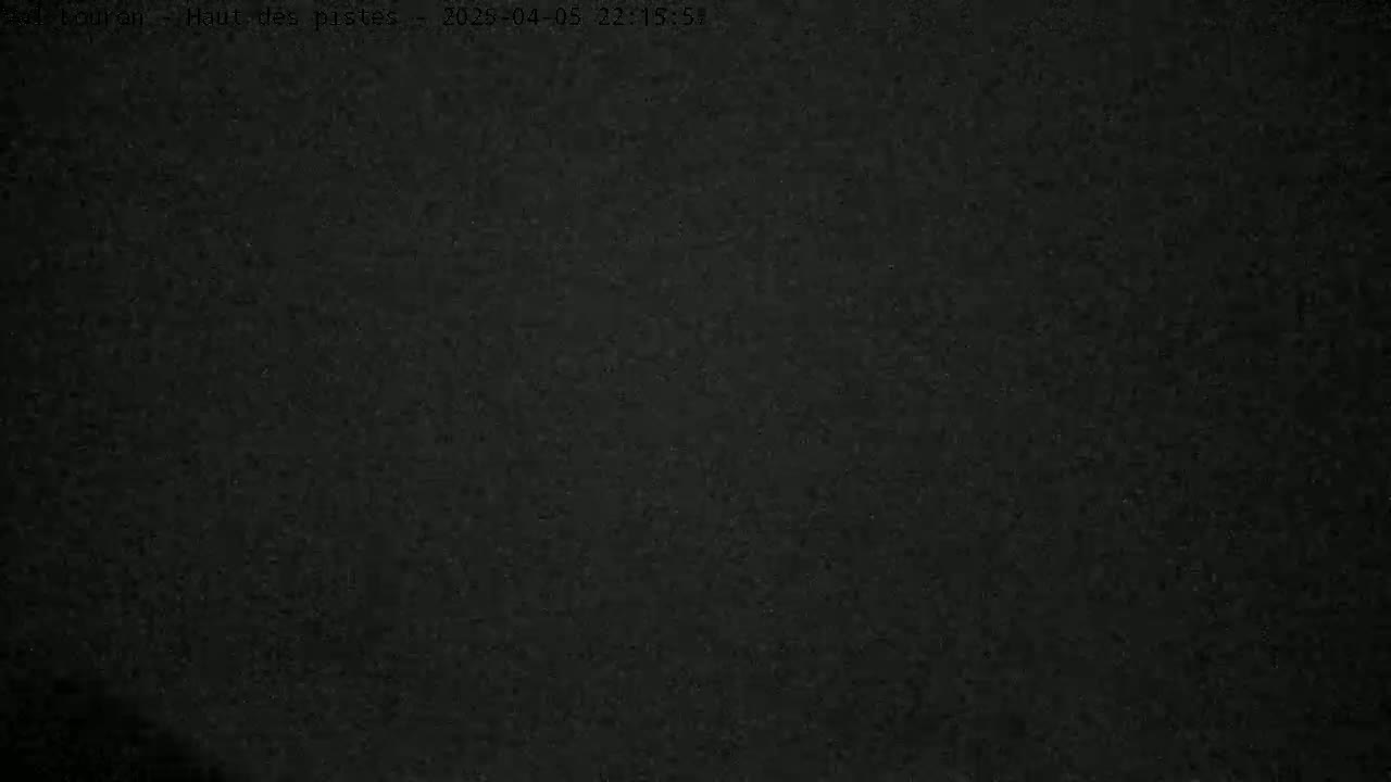 The image shows a completely dark, textured surface.