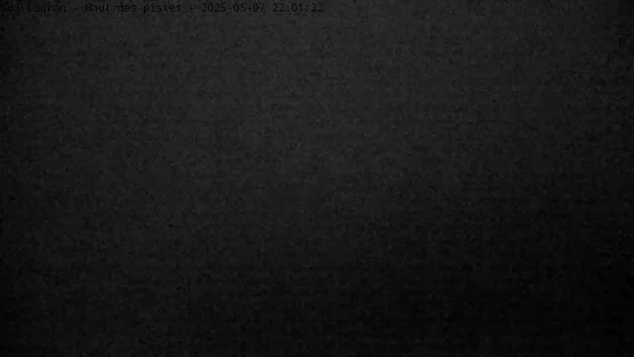 The image shows a dark, uniformly textured surface at night.