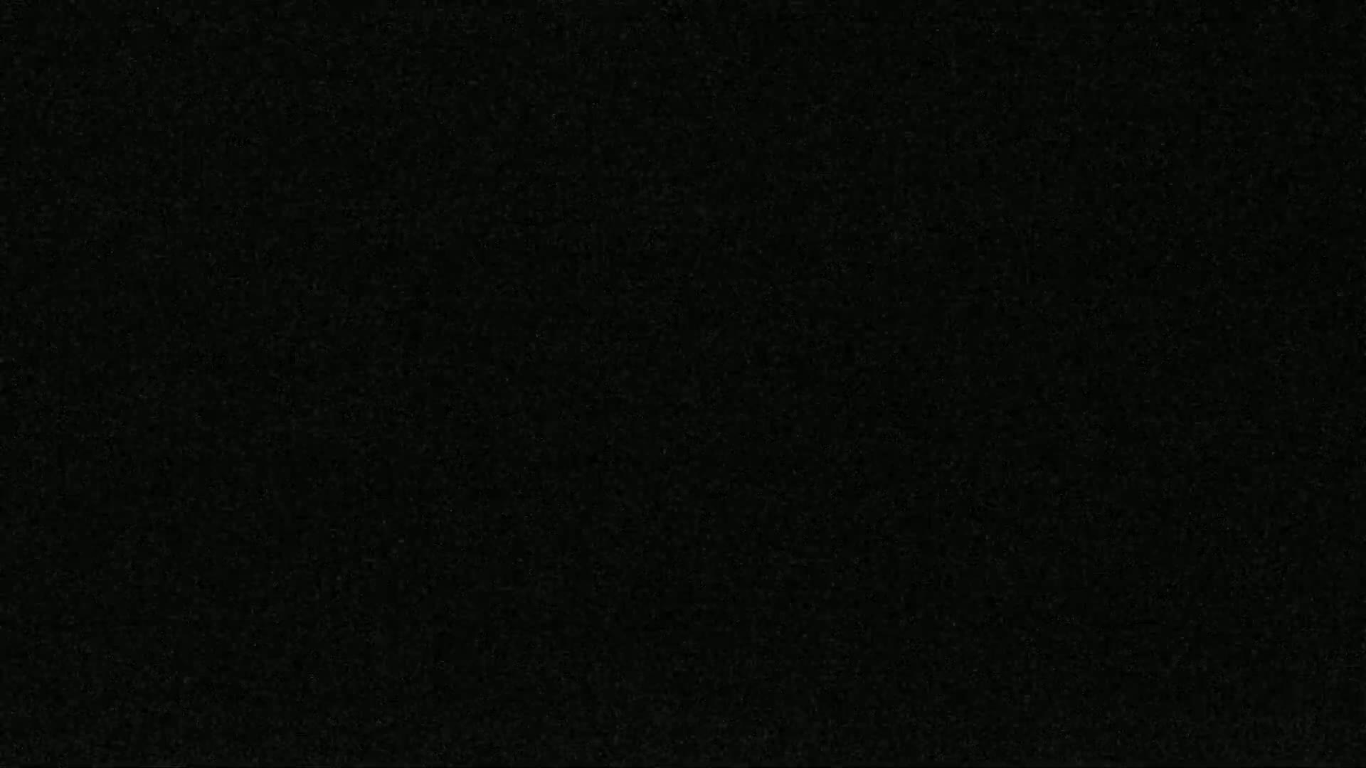 The image shows a dark, uniformly textured surface.