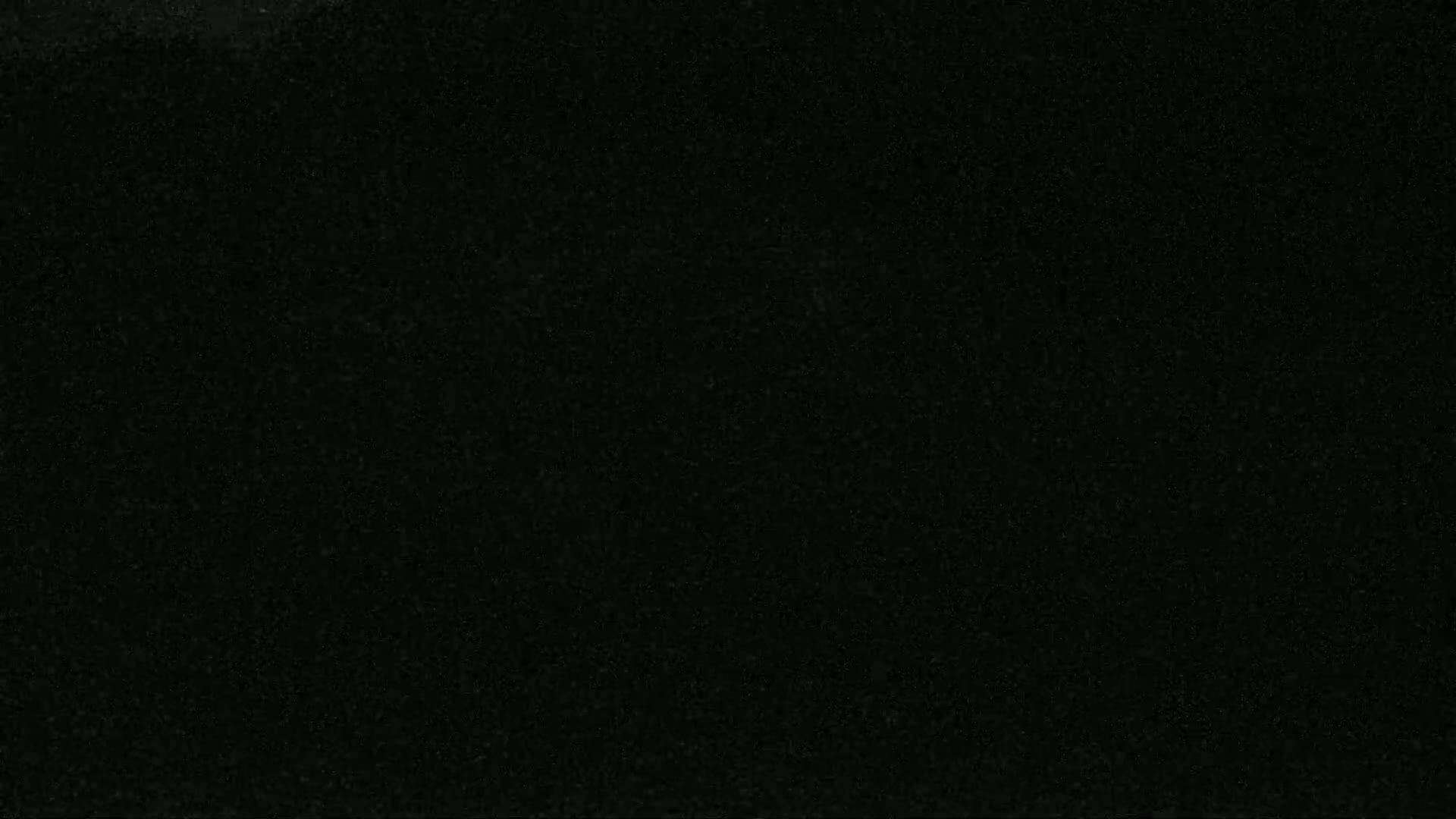 The image shows a uniformly dark gray or black textured surface.