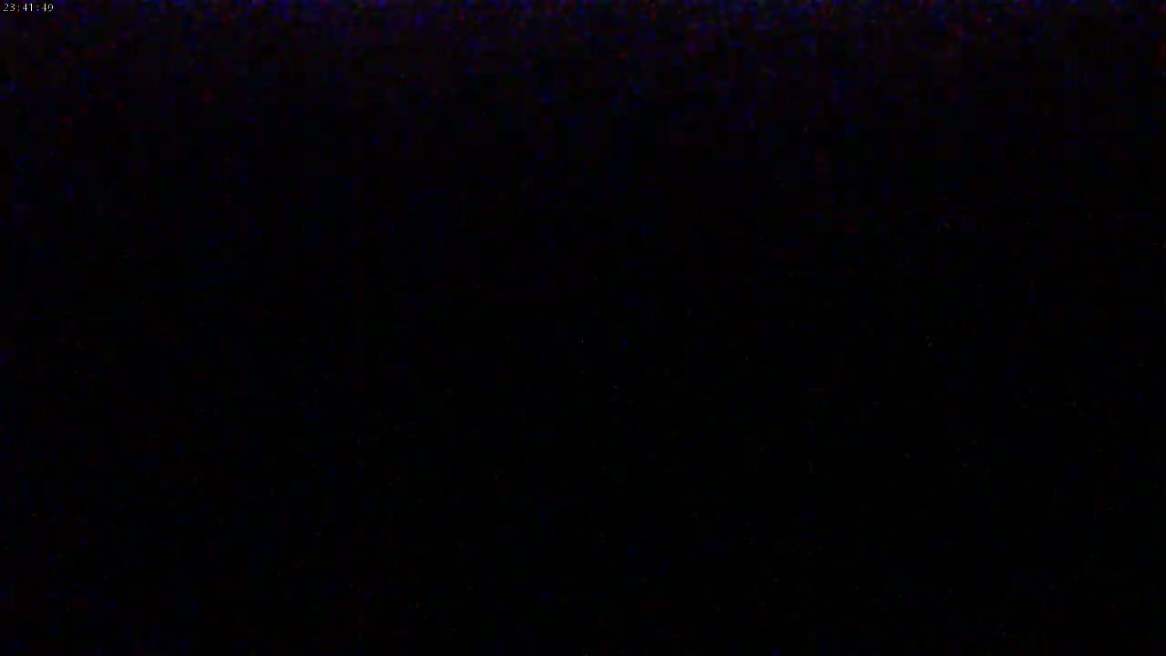The image shows a completely black screen with slight pixelation.