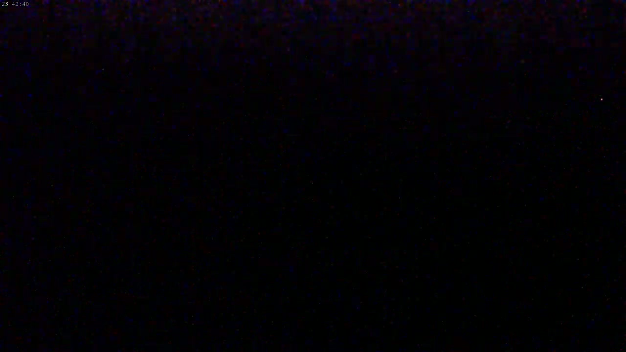 The image shows a completely dark scene, possibly at night.