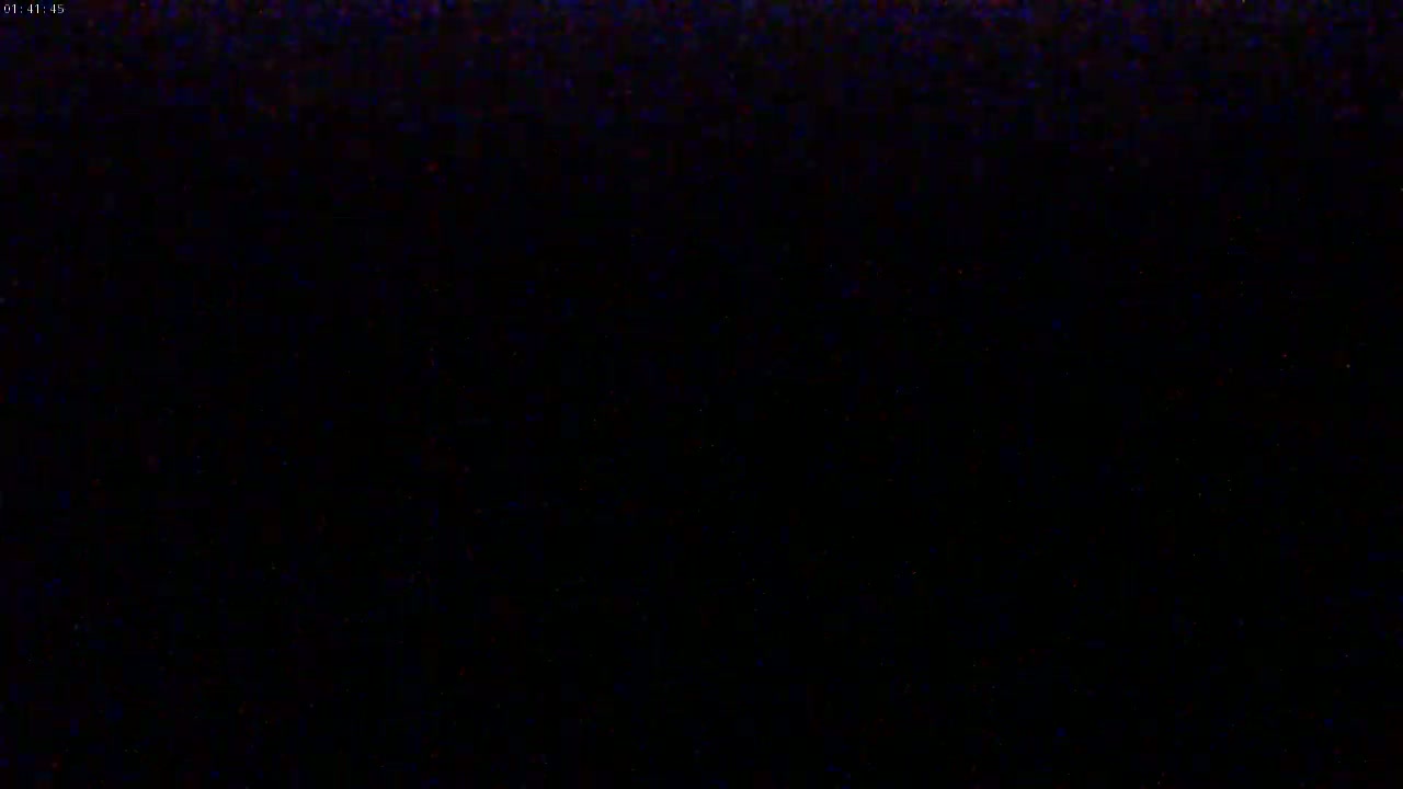 The image is entirely black with some faint, speckled noise.