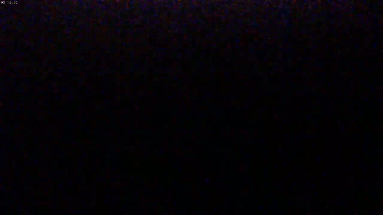 The image is an almost entirely black screen with minimal noise or artifacts.
