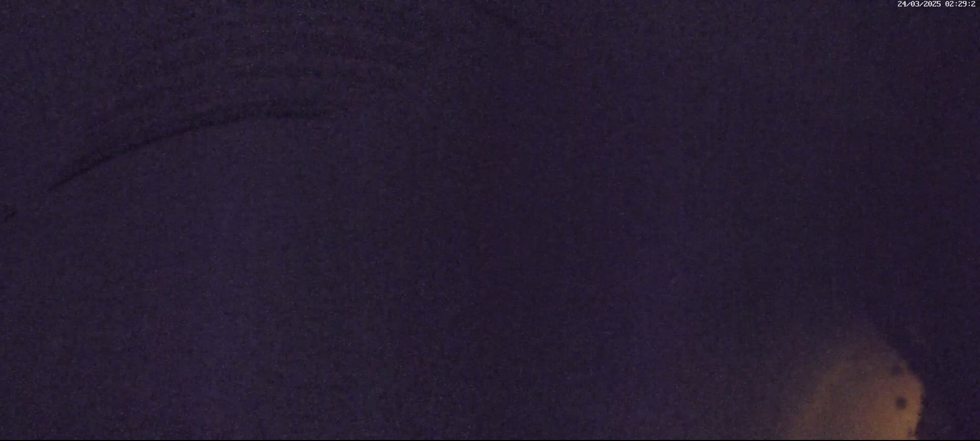 A dark purple or navy textured surface is shown, with a lighter area in the bottom right corner.