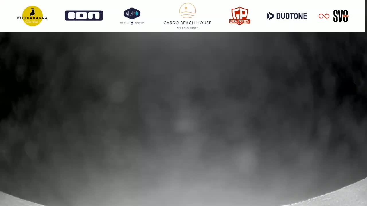 A blurry, dark gray image shows a misty or foggy scene.
