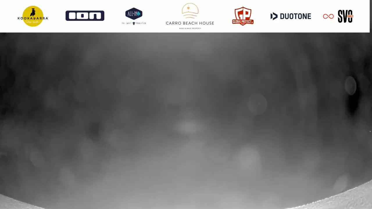 A blurry, dark gray image shows a hazy or foggy sky.