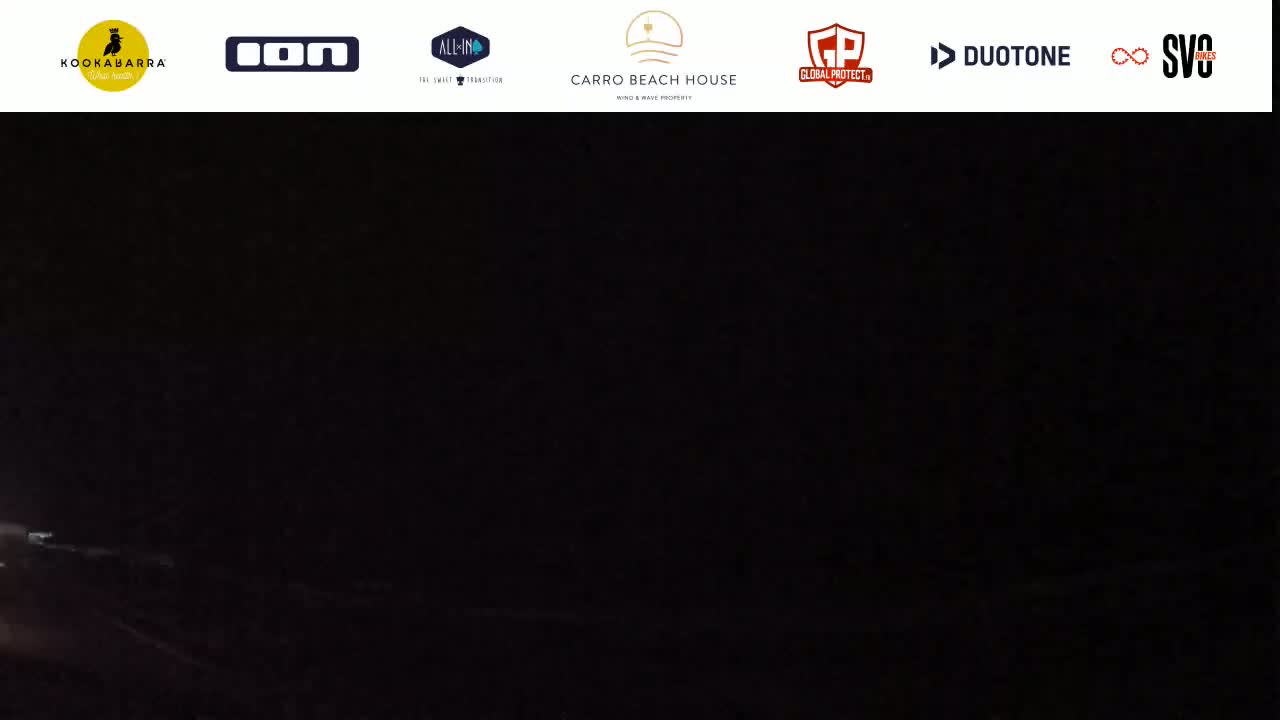 A dark, nighttime scene shows a faint light source in the lower-left corner.