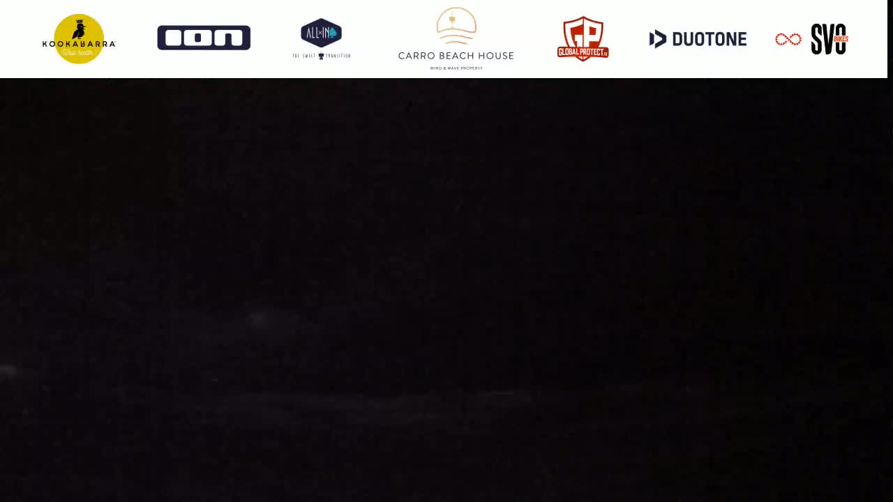 A nearly completely dark image shows a hint of a light-colored area at the bottom.