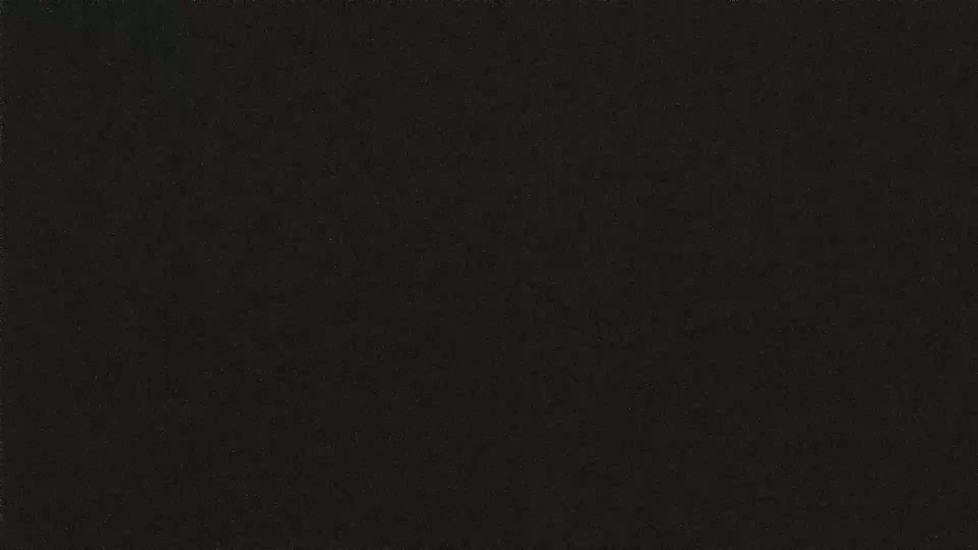The image shows a uniformly dark gray or black textured surface.