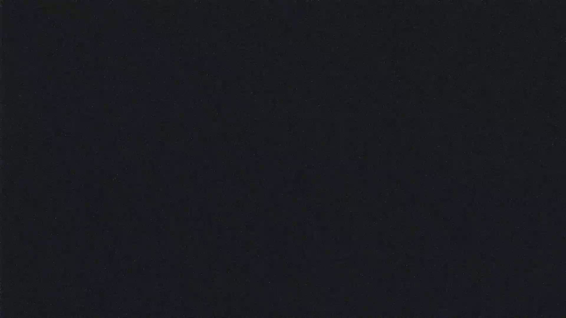 The image shows a dark, uniformly colored surface.