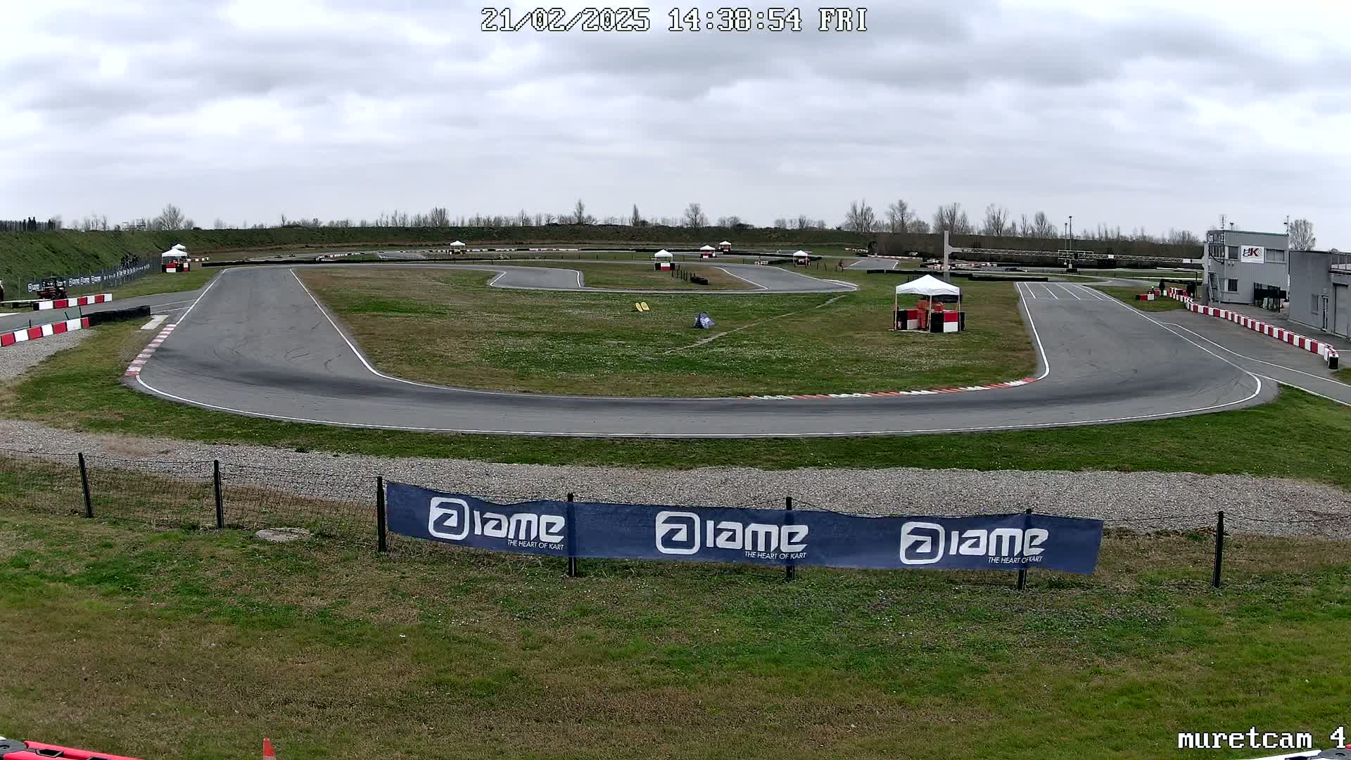 An outdoor go-kart track on an overcast day.