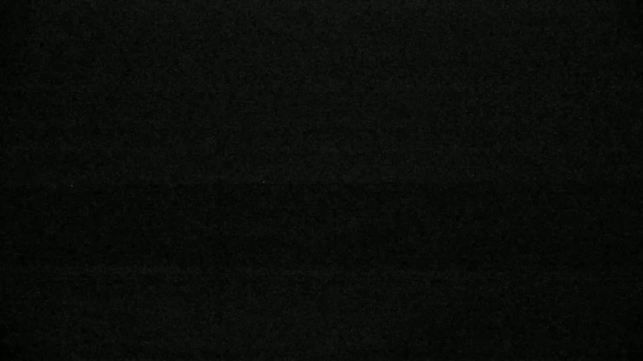 The image shows a dark, textured surface.