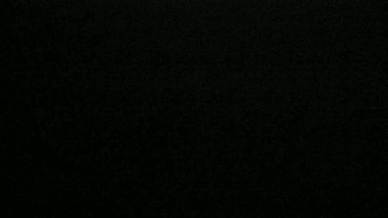 The image shows a dark, textured surface.