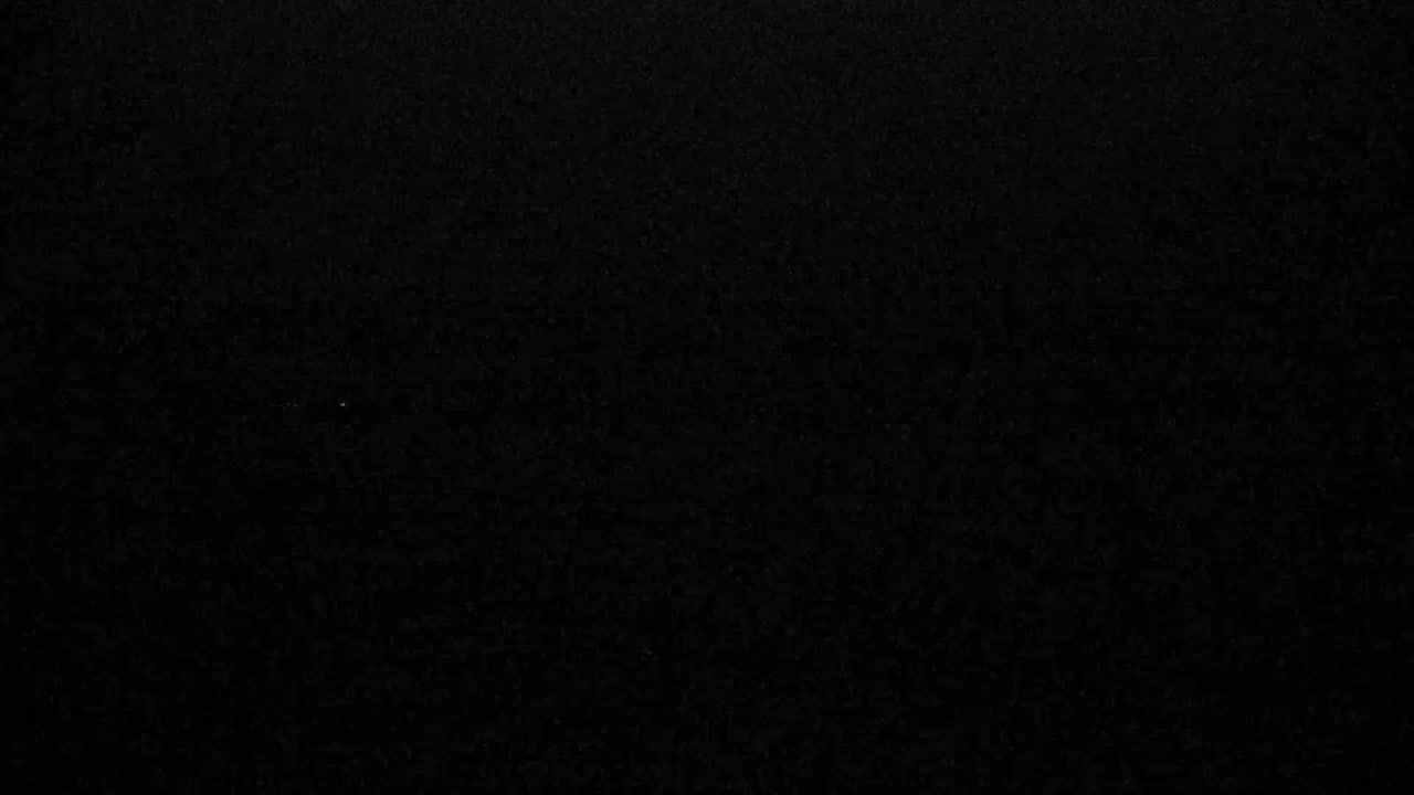 A dark, textured surface is shown.