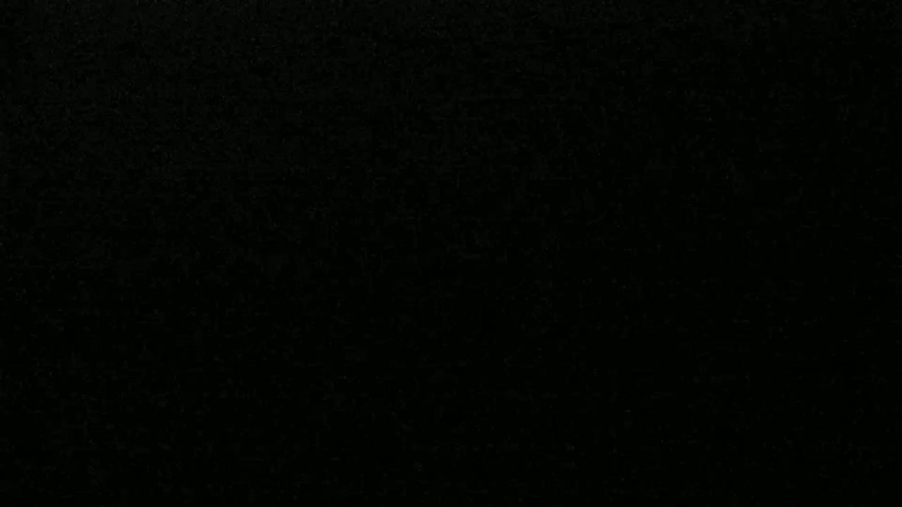 The image is a completely black surface with a slightly grainy texture.