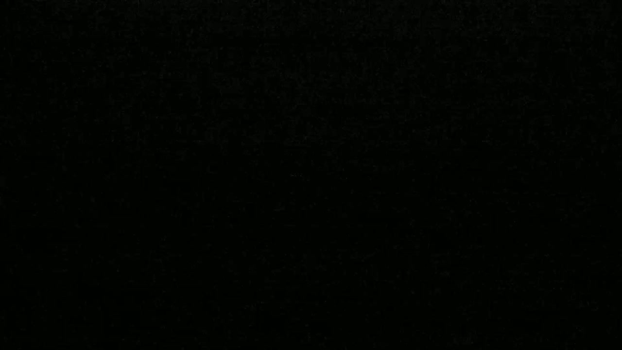 The image shows a completely black surface with a slightly grainy texture.