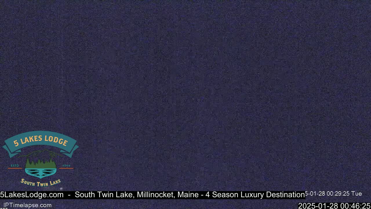 A dark, grainy image of a night sky.