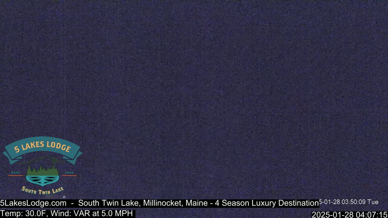 A dark, grainy image of a nighttime outdoor scene.