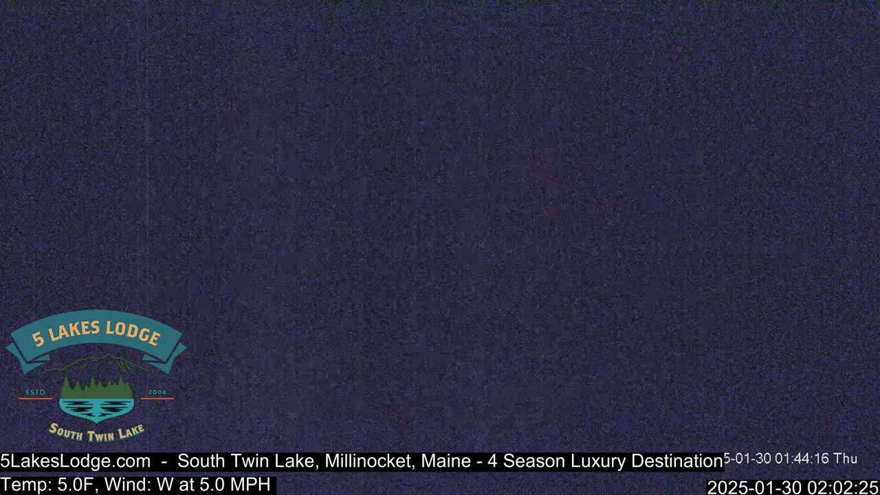 A dark blue, grainy image shows a mostly solid color with a logo for a lodge in the lower-left corner.