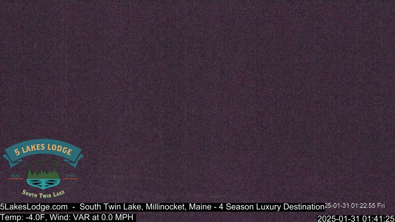 A dark purple screen displays a nighttime view with a temperature of -4.0°F and a variable wind at 0.0 mph.