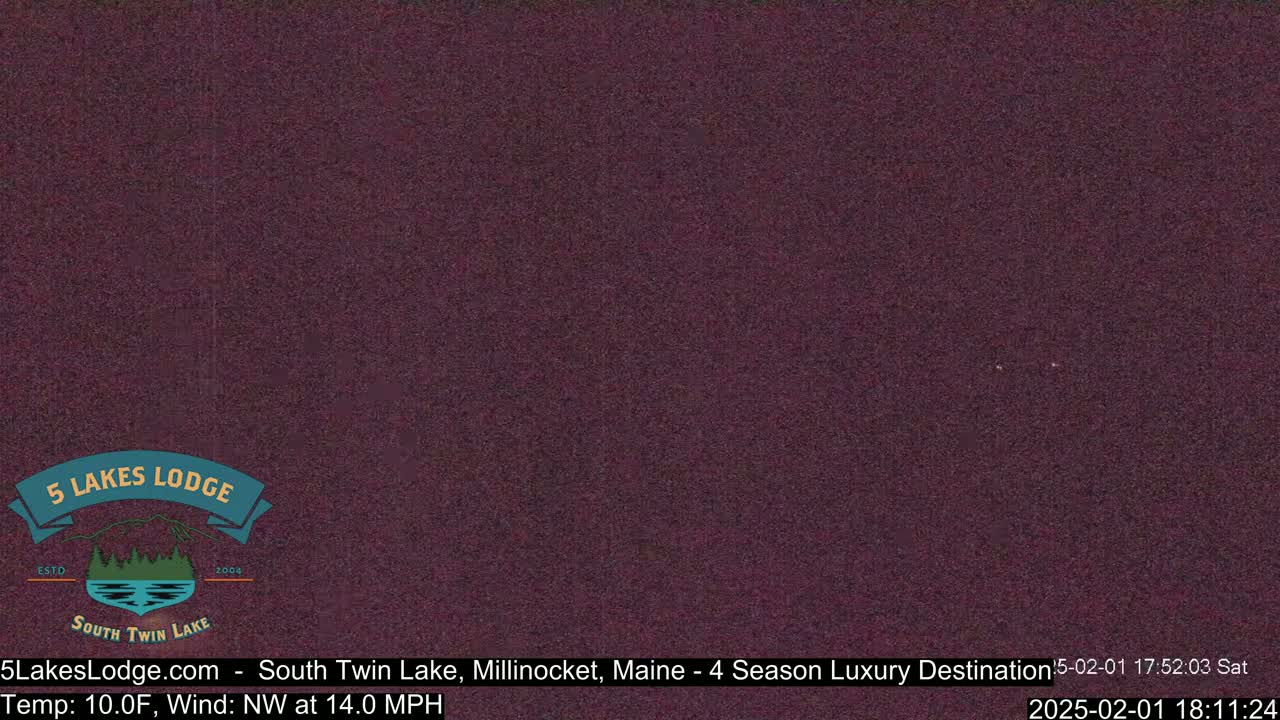 A dark purplish-brown image shows a nighttime outdoor scene with a northwest wind at 14.0 mph and a temperature of 10.0°F.