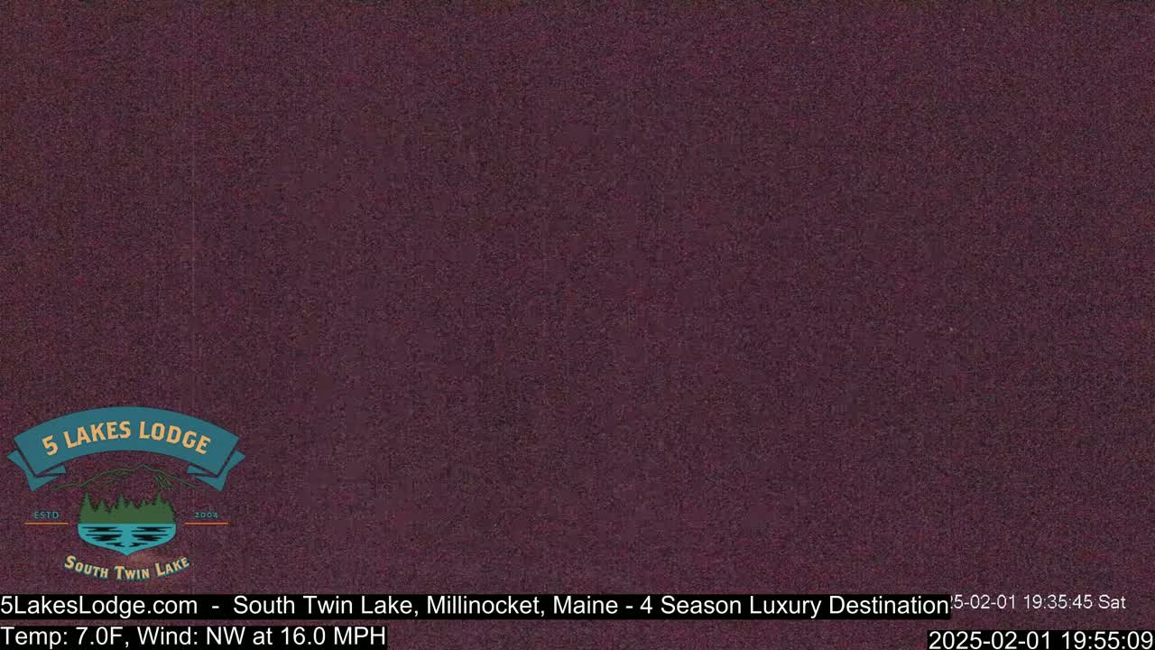A dark purple screen displays a static image.