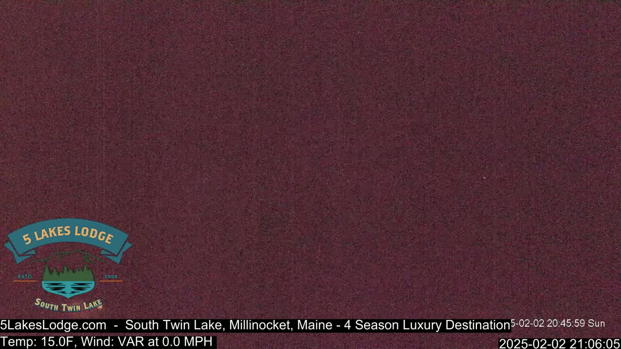 A uniformly dark reddish-brown image shows a solid, textured background.