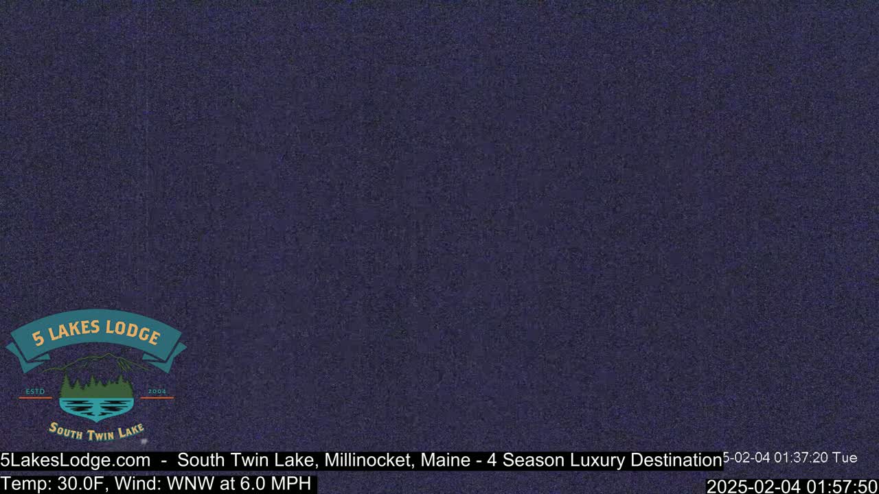 A dark blue, grainy image shows a mostly obscured view of an outdoor scene at 30 degrees Fahrenheit with a west-northwest wind of 6 miles per hour.