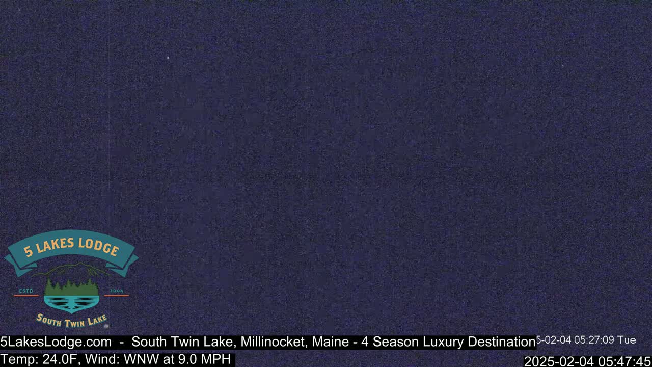 A dark blue, nighttime image shows a mostly clear sky.