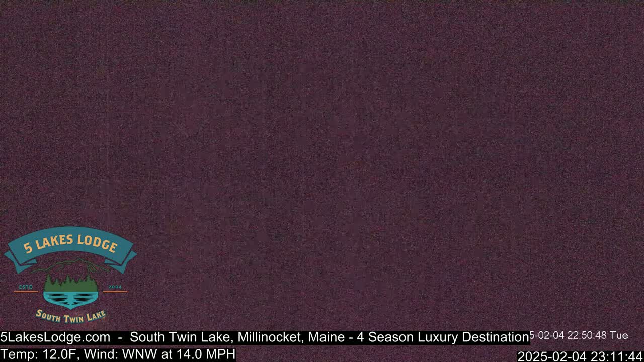 A dark purple screen shows a mostly obscured view of what appears to be nighttime outdoors, with a temperature of 12°F and a wind of 14.0 mph from the west-northwest.
