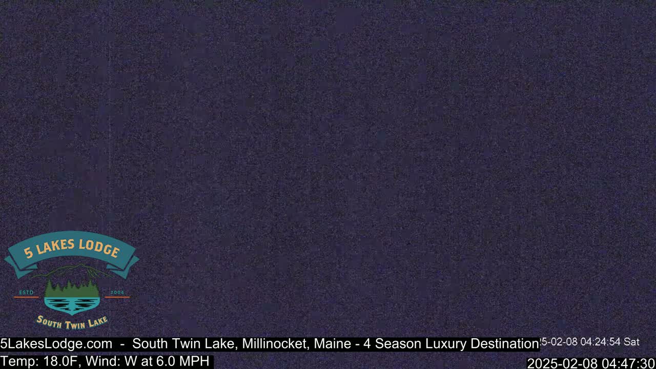 A dark, grainy image shows a nighttime view with a temperature of 18°F and a westerly wind at 6.0 mph.