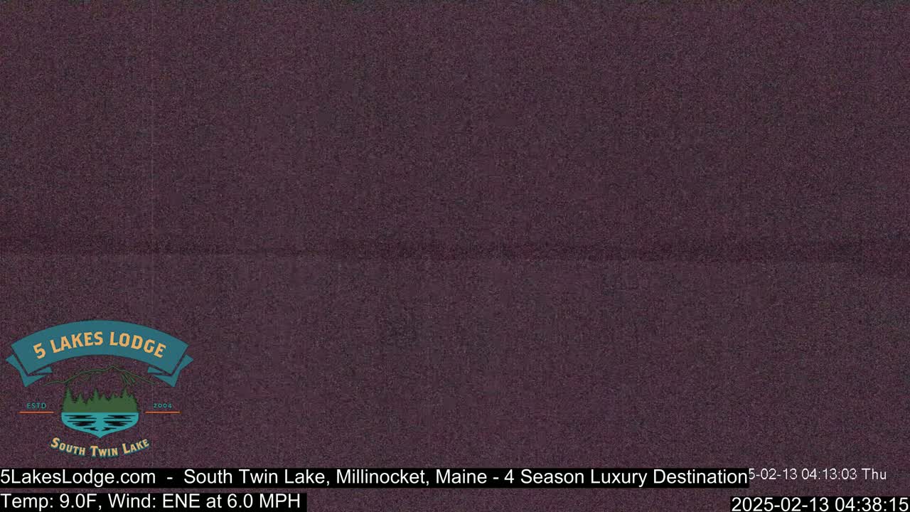 A dark purple, grainy image showing a mostly featureless view.