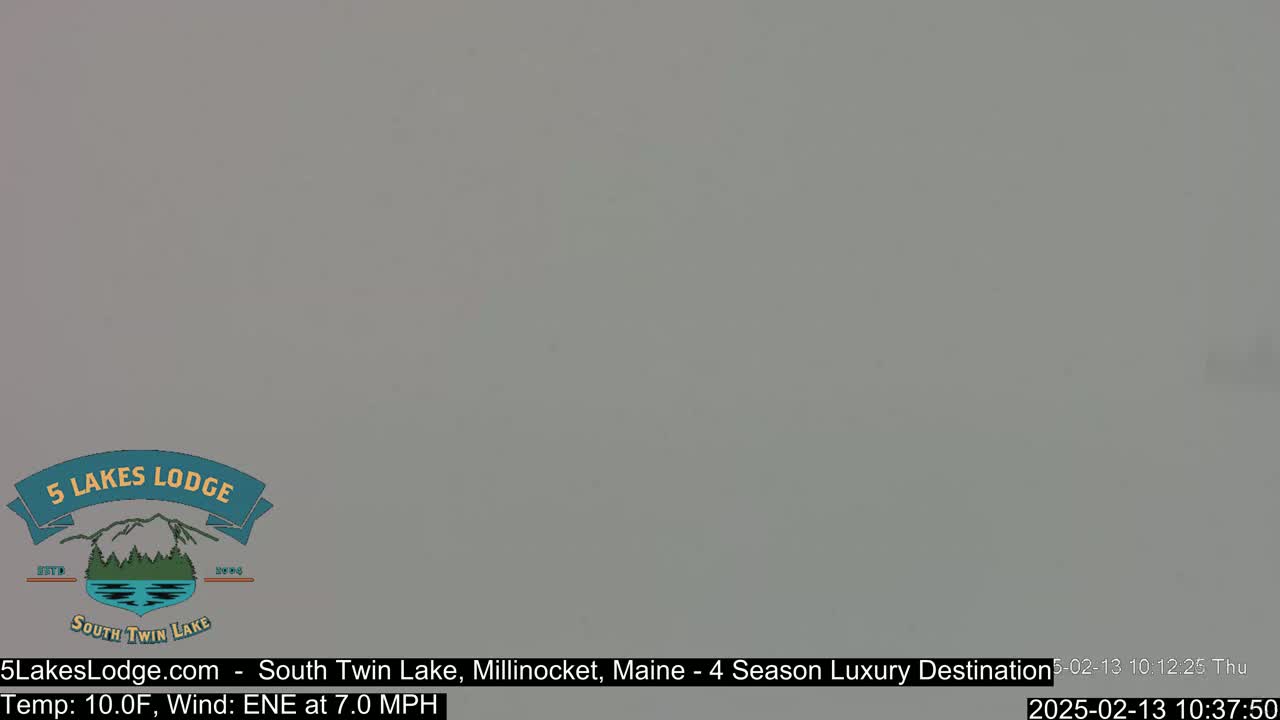A mostly overcast, gray sky with a temperature of 10°F and an east-northeast wind at 7.0 mph.
