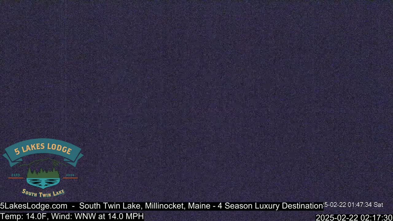 A dark purple screen shows a largely unreadable live feed of an outdoor scene, with a 14°F temperature and a 14 mph wind from the west-northwest.