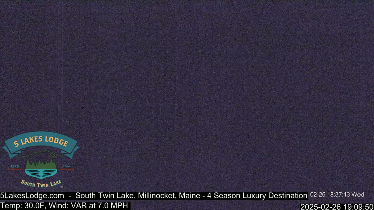 A dark, nighttime image of an overcast sky.