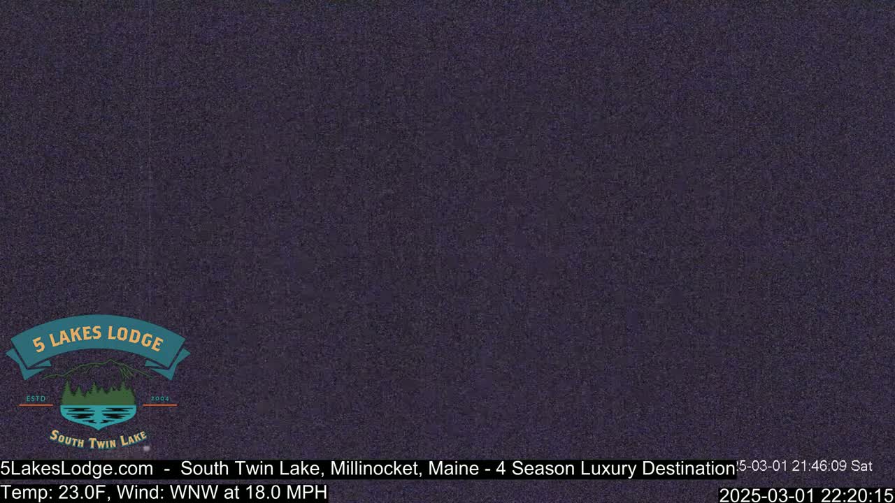 A dark, grainy image shows a nighttime outdoor scene with a wind of 18.0 mph from the west-northwest and a temperature of 23 degrees Fahrenheit.