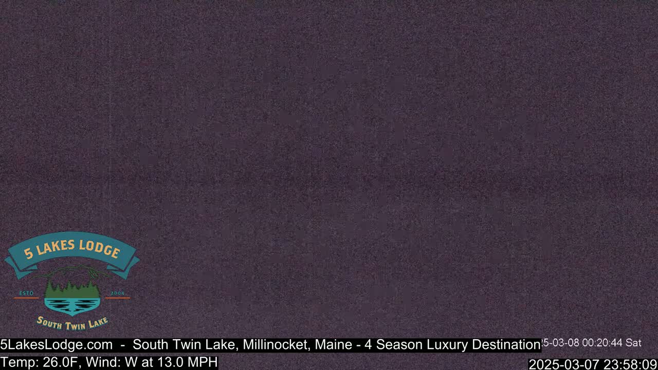 A dark purple screen displays a logo for a lodge.