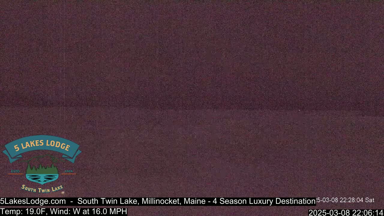 A dark, blurry image of a lake at night with a westerly wind of 16 mph and a temperature of 19°F.