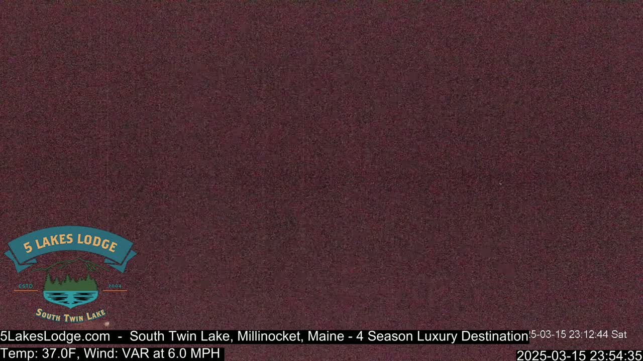A dark reddish-brown, grainy image shows a mostly clear night sky.