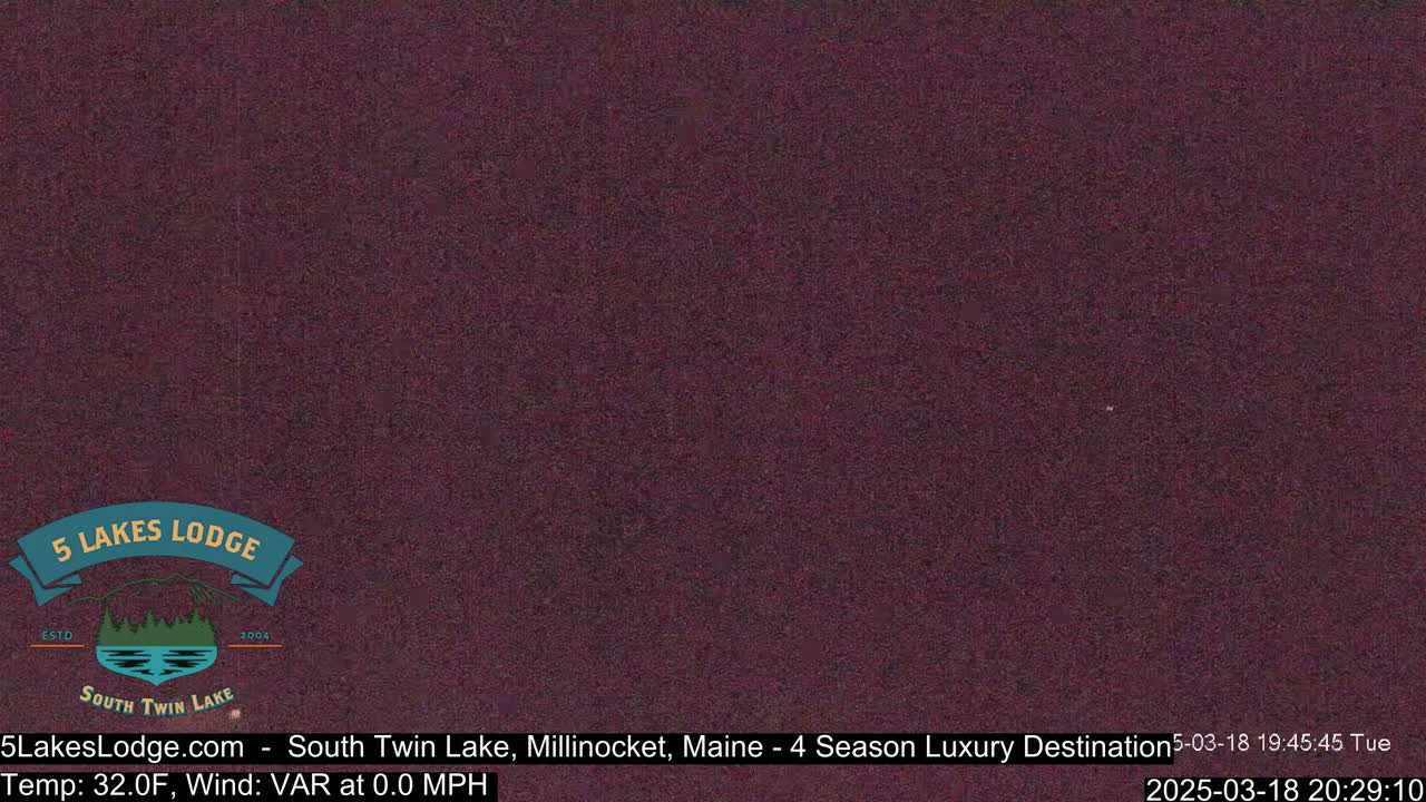 A dark purple screen displays a weather report of 32 degrees Fahrenheit with a variable wind at 0.0 mph.