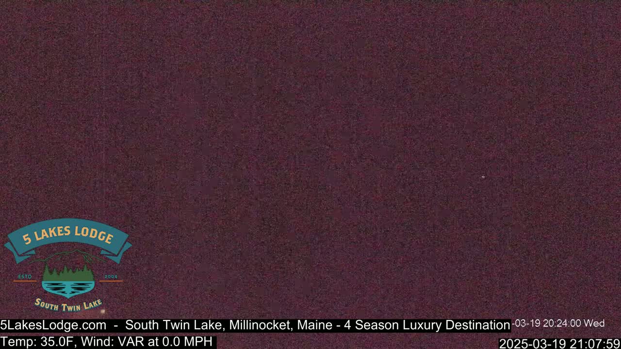 A dark purplish-brown image shows a mostly clear night sky.