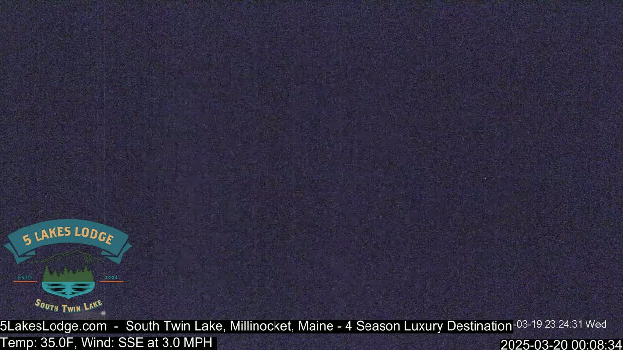 A dark, grainy image shows a nighttime outdoor scene.